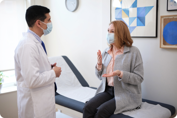 Actor portrayal of doctor talking to patient